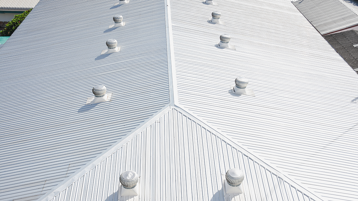 Industrial building with a regal white metal roof designed for energy efficiency