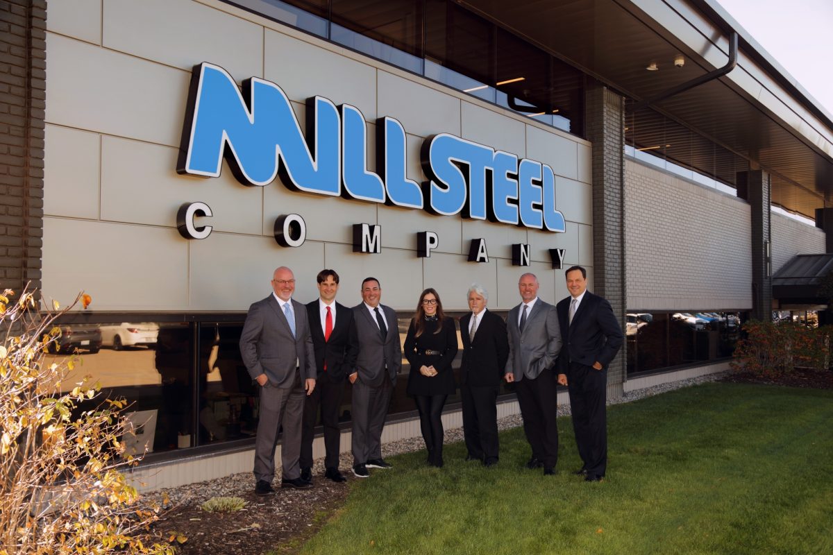 Mill Steel executive team stands in front of its Grand Rapids, MI headquarters.