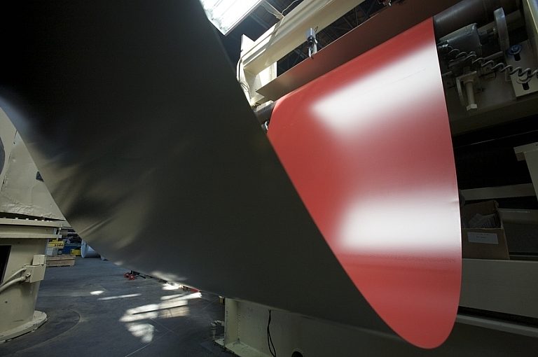 red coil coming out of machine