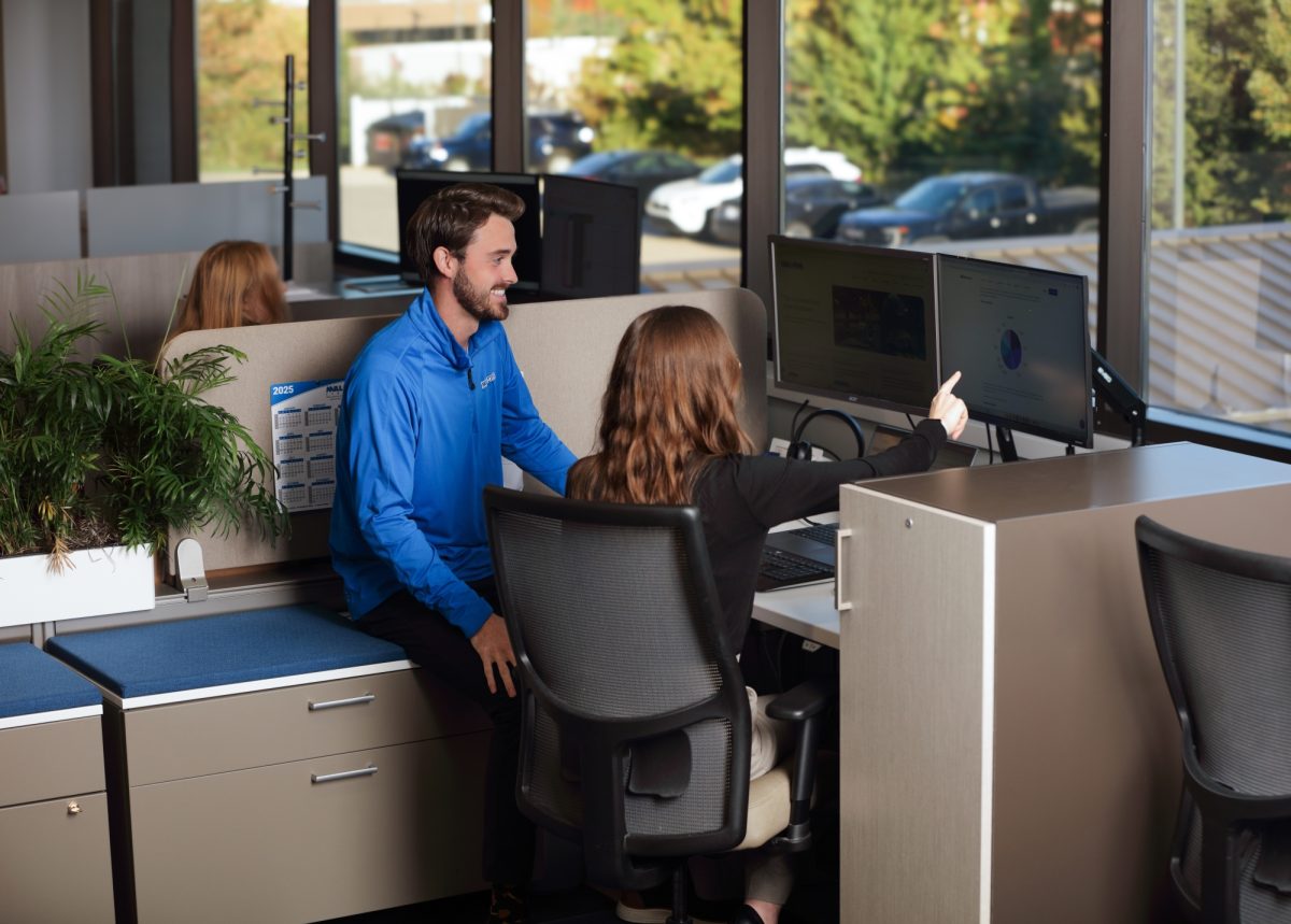 Mill Steel service team reviews a data center steel order on a computer screen.