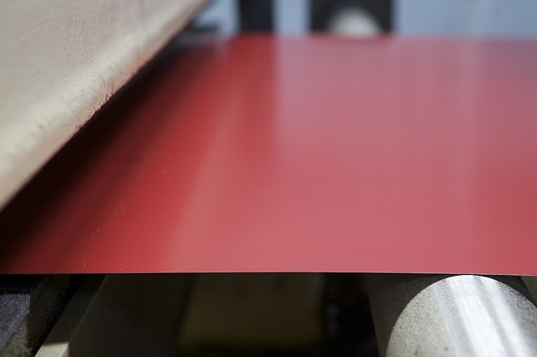 painted coil being prepared for forming